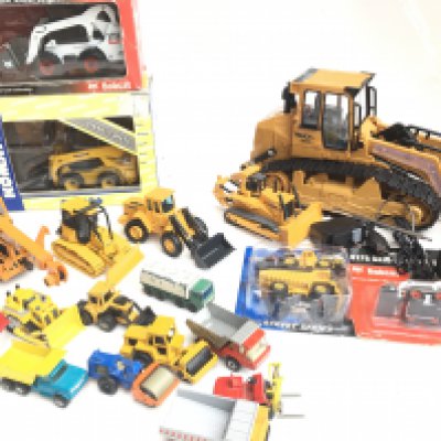 A Collection of Boxed And Loose Construction Vehicles Including a R/C Digger. Matchbox Etc.