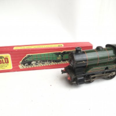 A Box Containing Model Railway items including a 00 Gauge Hornby Dublo Golden Fleece. Coaches. Track. And a 0 Gauge Locomotive.