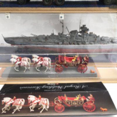 3 Built Model Kits including Bismarck. A Tank Transporter. A Truck and a Corgi 1902 State Landau Royal Wedding Coach 1982 with Box. All models Are in Display Cases. No Reserve.(4).