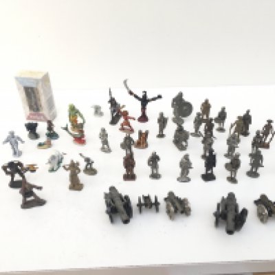 A collection in excess of forty pieces of metal figures from different genres and ages including Warhammer.