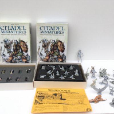A collection of approximately 40 metal Warhammer figures mainly unpainted includes two citadel boxes.