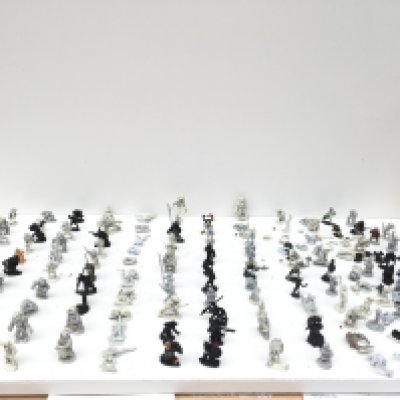 A collection in excess of 130 metal Warhammer figures mostly unpainted.