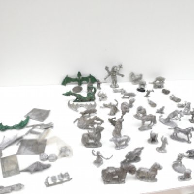 A group in excess of 50 metal figures and accessories from a Warhammer collection mostly unpainted.