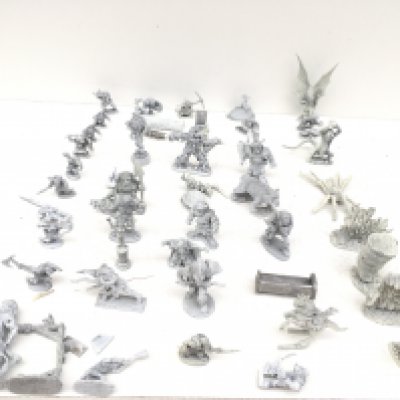 A box containing 50 metal model figures and accessories from a Warhammer collection. Made by Pal Ratha..Grenadier etc all are unpainted.