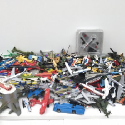 A box containing a large number of Playworn models..mainly aircraft but some cars and hovercraft