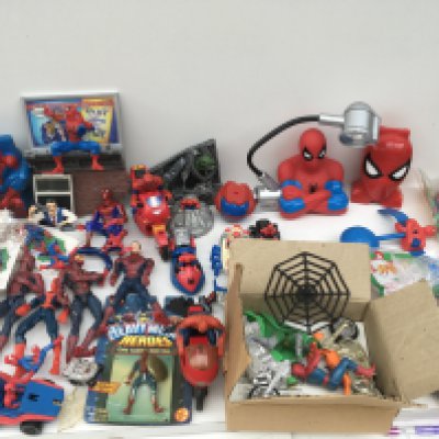 A collection of Spider-Man items including action figures..vehicles..unopened McDonald&rsquo;s toys..play sets etc
