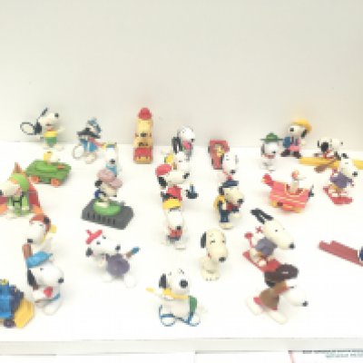 A collection of 30 Collectable Snoopy figures of varying ages.