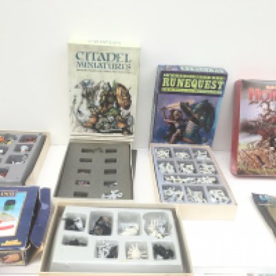 A group of 5 boxes containing metal and plastic model figures from a warhammer collection. Also includes resin stone dragon and box hobby starter set.