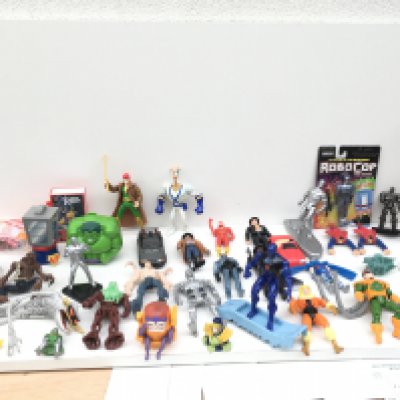 A varied collection in excess of 40 pieces super hero related items mostly figures but some accessories by various manufacturers.