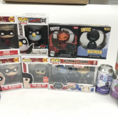A Collection of Boxed Funko Pop Figures and Soda Pops.