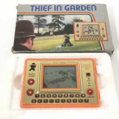 A Boxed Tronica Thief in The Garden 1982 Electronic LCD Handheld Game.