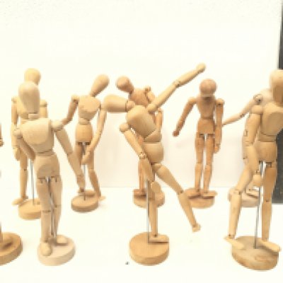 A collection of of 9 articulated human wooden mannequins approximately 12 inches. All have good movement to joints enabling any poses to remain.