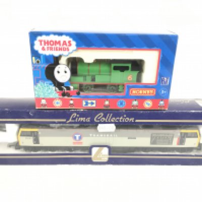 2 Boxed 00 Gauge Locomotives a Lima Diesel Locomotive. a Hornby Thomas And Friends Percy. And a Collection of Buildings Etc.