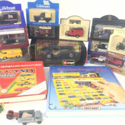 A Collection of boxed Modern Diecast Buses. Lorries.Cars including Days gone and collectors books.NO RESERVE