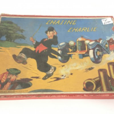 A Boxed Chasing Charlie Board Game.