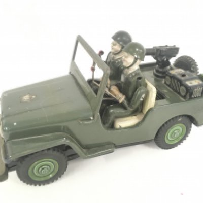 A Battery Opperated Tinplate Jeep.