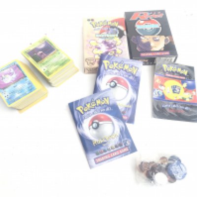 A Collection of Pokemon Cards and 2 Empty Boxes.