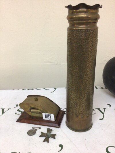 A Trench Art I world war Tank model Amiens a trench art shell case a 1919 peace medal and a German Third Reich Second class war merit medal