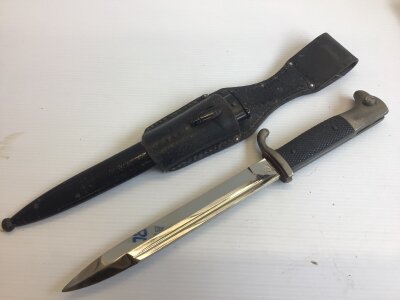 A German Third Reich K98 dress bayonet makers stamp WKC with a leather frog.