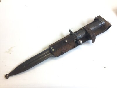 A Swedish 1890 bayonet with an engine turned grip and leather frog
