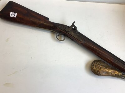 A 19th Percussion Sporting rifle half length walnut stock with a long barrel muzzle load sold with a brass powder flask