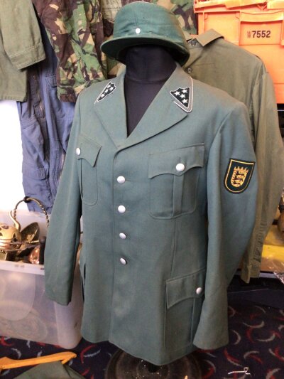 A German 1950s Police Uniform with hat and trousers.