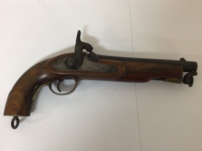 An Antique British Service Military issue Percussion Pistol  The action stamped Birmingham 1869 with Royal crown and military stamp. EIG. Issued to East India Government. The Pistol with brass fittings hinged steel ram rod. Length 35cm