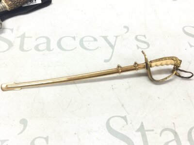 An original miniature sword by Carl Eickhorn with engraved blade and portapee (condition near mint) 28cm total length