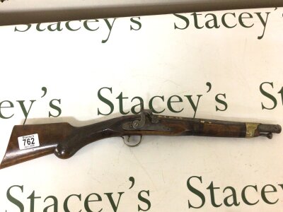 An interesting 19th century Continental Percussion short rifle. With a walnut stock the barrel embellished with gold decoration brass fittings length 58cm