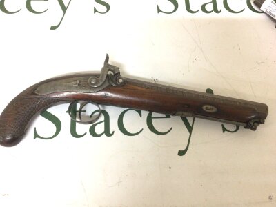 A 19th century target or Duelling Pistol Percussion with a nice octagonal Damascus barrel walnut stock the action engraved with the scrolls no obvious maker or marks action functions length 36cm