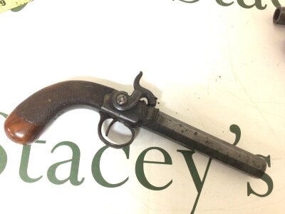 A 19th century Percussion pistol maker Kemp of London with a walnut cross hatched grip and octagonal steel barrel with proof marks