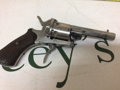 A late 19th century Belgium made pin fire revolver 7.4 obsolete caliber with folding trigger.