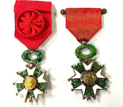 A vintage French Legion D’Honneur officer’s badge, dating from the 3rd Republic era of 1870-1951 together with similar example. (Some chipping to enamel.