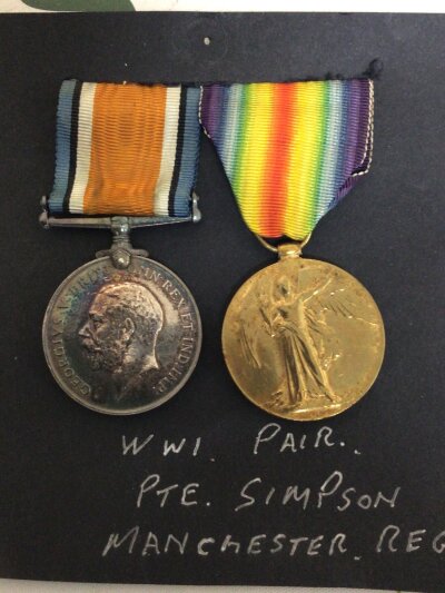 A Group of two I world war medals awarded to 58469 Pte Simpson Manchester Regiment. (2)