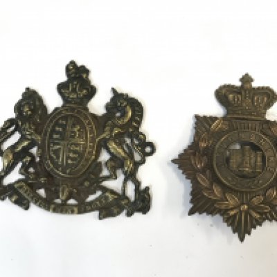 Devonshire helmet plate and a brass coat of arms plate