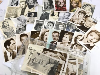 A large quantity of film ephemera signed photos including Elizabeth taylor , Bob Hope etc