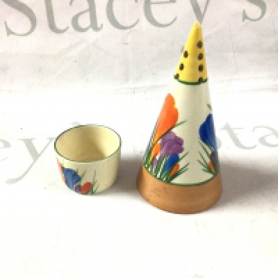 A Clarice Cliff egg cup and shaker.