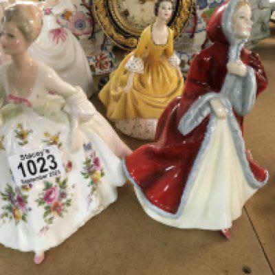 Three Royal Doulton figures .