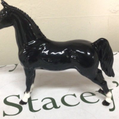 A limited edition John Beswick model of a black stallion with four white socks. No obvious damage or restoration.