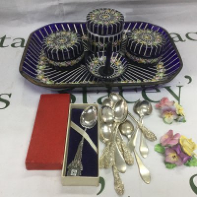 A glass dressing table set decorated with flowers plus some spoons etc. Shipping category D.