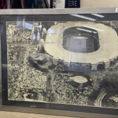 A large framed photo of Wembley Stadium c.1970s (some damage) .98cm x 76cm