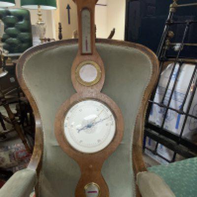 An Oak silvered dial barometer. 94cm.- NO RESERVE
