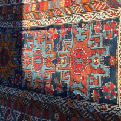 A Persian geometric pattern runner with repeat pattern boarders.