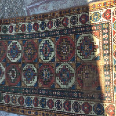 A Persian geometric design runner with repeated pattern boarders. 270x 100 cm .