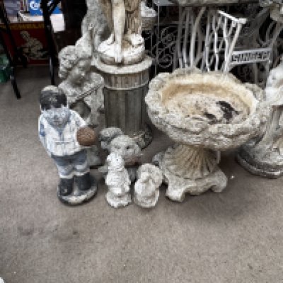 A mixed lot of garden statuary. 7 pieces to include nude maiden, cherub playing a violin, planter 4 smaller figures.