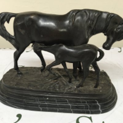 A bronze figure of a horse with foal on a stepped marble base. Heigh 21cm.