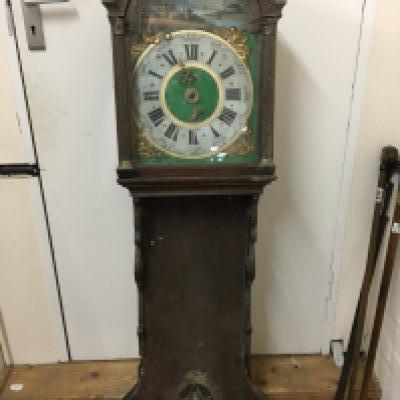 A 19th century Continental wall clock with a painted dial and brass weight restoration project