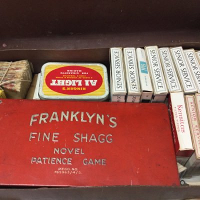 A briefcase with cigarette/ trade cards and Franklyns fine shagg patience game. Postage category B
