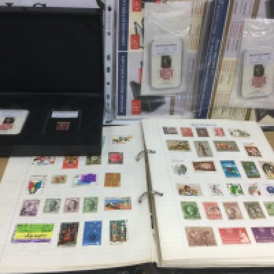 A collection of commemorative presentation packs and others, stamps including two albums of world stamps etc.