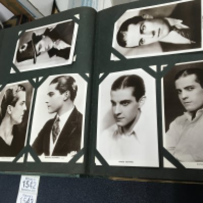 Four albums containing postcards including Edwardian and later film stars .